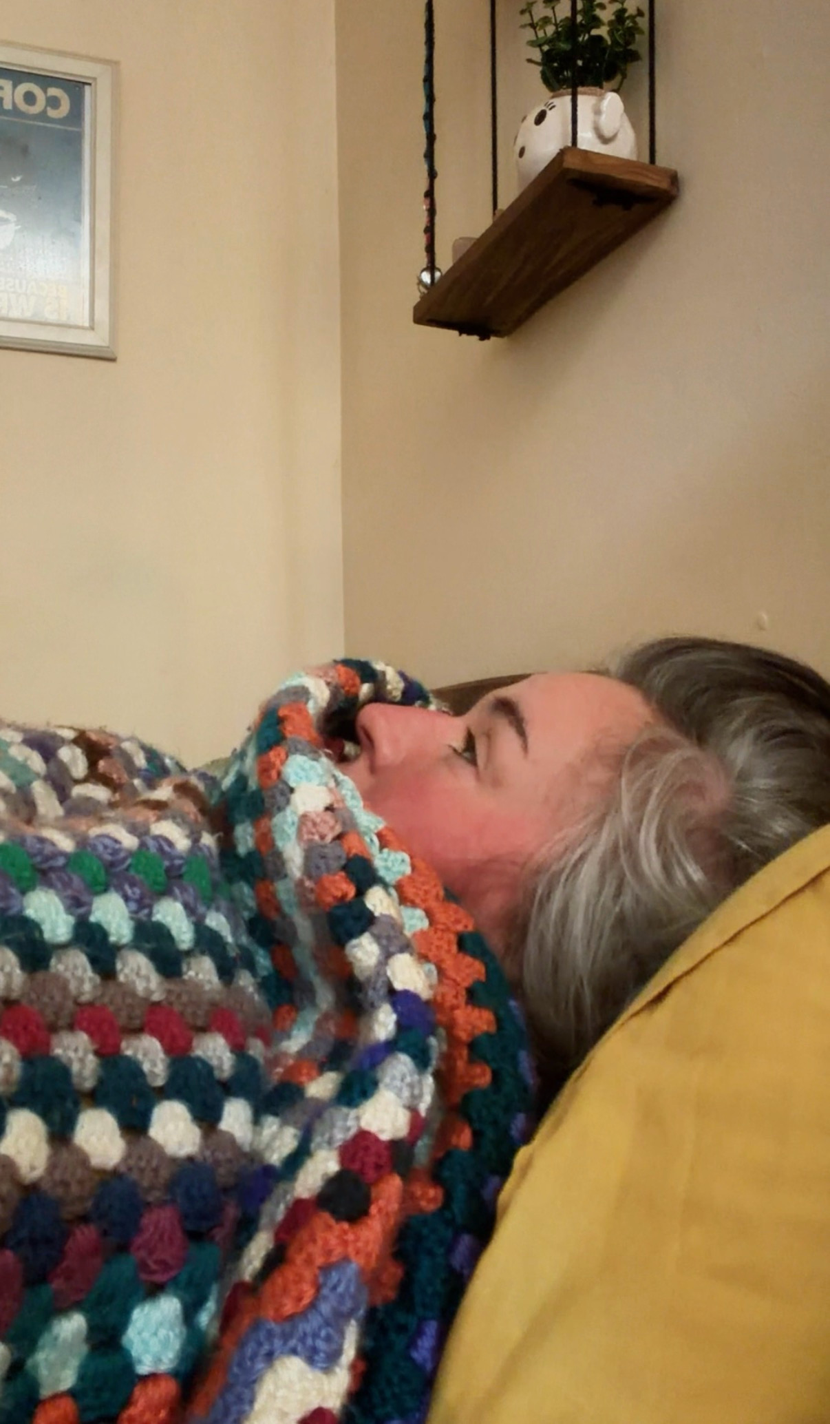 PERSON LAYING IN BED STARRING AT CEILING